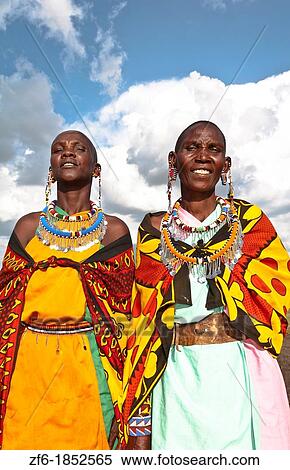 Kenya Masai Mara reserve with two Masai women in colorful dress with blue sky in Masai Mara National Park in reserve 10 View Large Photo Image Stock Photography - Kenya Masai Mara reserve with two Masai women in colorful dress with blue sky in Masai Mara National Park in reserve 10. Fotosearch
