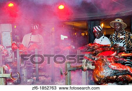 Stock Image - Kenya Nairobi Africa the famous grill at the Carnivore restaurant called Beast with a Feast with game meat cooking 11. Fotosearch