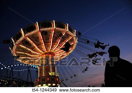 Kettenkarussel of the Munich Oktoberfest in the twilight View Large Photo Image Stock Photo - Kettenkarussel of the Munich Oktoberfest in the twilight. Fotosearch