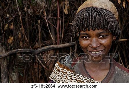 Key Afer Ethiopia Africa village Lower Omo Valley closeup of a Hamar or Hammer woman traditional outfits and red hair portrait 14 View Large Photo Image Picture - Key Afer Ethiopia Africa village Lower Omo Valley closeup of a Hamar or Hammer woman traditional outfits and red hair portrait 14. Fotosearch