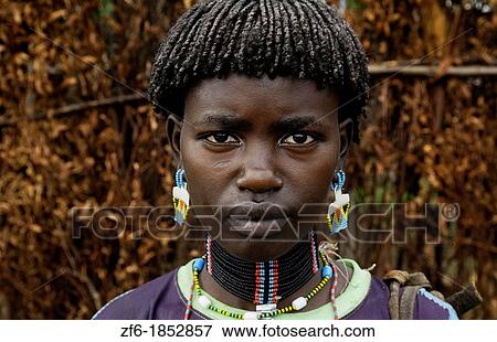 Key Afer Ethiopia Africa village Lower Omo Valley portrait closeup of Bena tribe woman with beads and traditional outfits 14 View Large Photo Image Stock Photo - Key Afer Ethiopia Africa village Lower Omo Valley portrait closeup of Bena tribe woman with beads and traditional outfits 14. Fotosearch