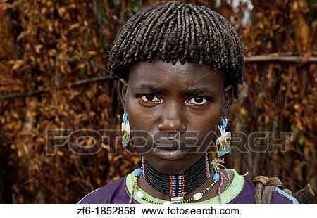 Stock Photo - Key Afer Ethiopia Africa village Lower Omo Valley portrait closeup of Bena tribe woman with beads and traditional outfits 14. Fotosearch