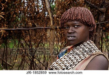 Key Afer Ethiopia Africa village Lower Omo Valley closeup of a Hamar or Hammer woman traditional outfits and red hair portrait 14 View Large Photo Image Stock Photo - Key Afer Ethiopia Africa village Lower Omo Valley closeup of a Hamar or Hammer woman traditional outfits and red hair portrait 14. Fotosearch