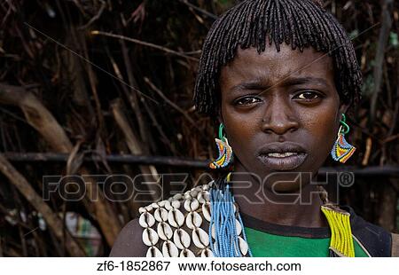 Key Afer Ethiopia Africa village Lower Omo Valley closeup of a Hamar or Hammer woman traditional outfits and red hair portrait 14 View Large Photo Image Stock Photo - Key Afer Ethiopia Africa village Lower Omo Valley closeup of a Hamar or Hammer woman traditional outfits and red hair portrait 14. Fotosearch