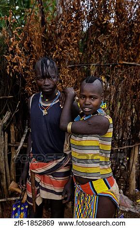 Stock Photo - Key Afer Ethiopia Africa village Lower Omo Valley portrait closeup of Bena tribe couple man and woman with beads and traditional outfits 14. Fotosearch