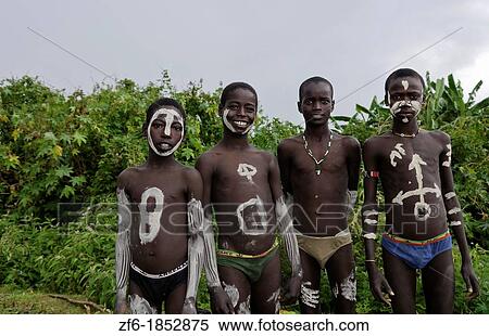 Key Afer Ethiopia Africa village Lower Omo Valley closeup of two Bena boys with white paint on their bodies 15 View Large Photo Image Stock Photography - Key Afer Ethiopia Africa village Lower Omo Valley closeup of two Bena boys with white paint on their bodies 15. Fotosearch