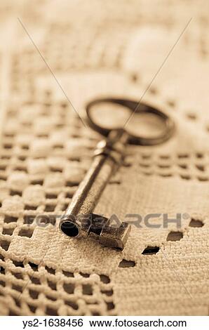 Key lying on tablecloth View Large Photo Image Stock Photograph - Key lying on tablecloth. Fotosearch