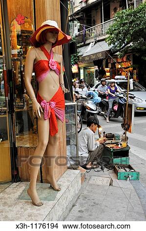 key maker sitting on the pavement, street of the Old Quarter of Hanoi, Northern Vietnam, southeast asia View Large Photo Image Picture - key maker sitting on the pavement, street of the Old Quarter of Hanoi, Northern Vietnam, southeast asia. Fotosearch