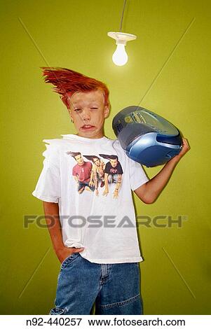 Kid being blown away by radio. 8 year old boy. View Large Photo Image Stock Photo - Kid being blown away by radio. 8 year old boy.. Fotosearch