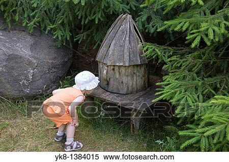 Kid Girl Looking Small Fairy-Tale House at Pokumaa, V? ru County, Estonia View Large Photo Image Stock Photography - Kid Girl Looking Small Fairy-Tale House at Pokumaa, V? ru County, Estonia. Fotosearch