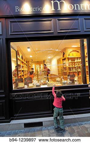 Kid in a candy shop. 16, Norvins street. Montmartre area. Paris, France. View Large Photo Image Stock Photo - Kid in a candy shop. 16, Norvins street. Montmartre area. Paris, France.. Fotosearch
