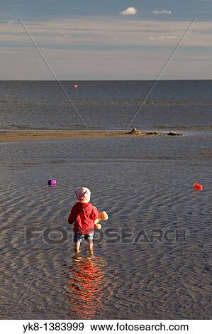 Stock Photo - Kid in Water on P? rnu Beach, Estonia, Europe. Fotosearch