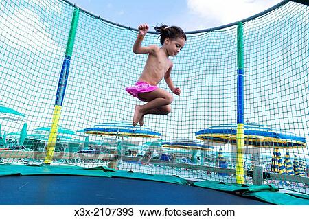 Stock Image - Kid jumping around.. Fotosearch