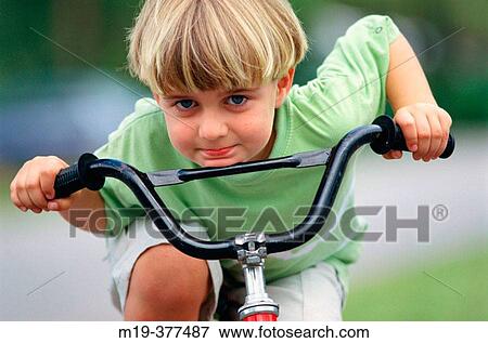 kid on a bike View Large Photo Image Stock Photo - kid on a bike. Fotosearch