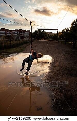 Kid playing at? Parc de la Tirolina?, Montgat, Barcelona, Catalonia, Spain View Large Photo Image Stock Image - Kid playing at? Parc de la Tirolina?, Montgat, Barcelona, Catalonia, Spain. Fotosearch