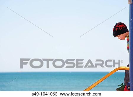 kid playing on the beach View Large Photo Image Stock Image - kid playing on the beach. Fotosearch