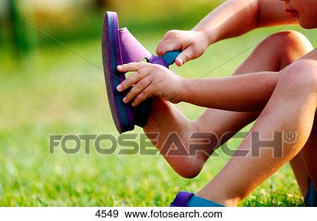Kid wearing shoes View Large Photo Image Stock Photo - Kid wearing shoes. Fotosearch