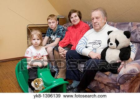 Kids and Elderly Seniors Grandparents Sitting, Family on Sofa View Large Photo Image Stock Photo - Kids and Elderly Seniors Grandparents Sitting, Family on Sofa. Fotosearch