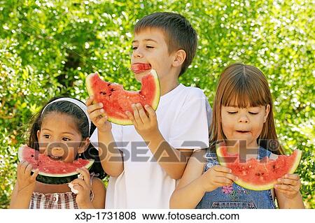 Stock Photo - Kids eating watermelon. Fotosearch
