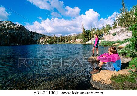Kids enjoying the view along the shore of Boothe Lake, in the Cathedral Range, Sierra Nevada Mountains. Yosemite NP. California. USA View Large Photo Image Stock Image - Kids enjoying the view along the shore of Boothe Lake, in the Cathedral Range, Sierra Nevada Mountains. Yosemite NP. California. USA. Fotosearch