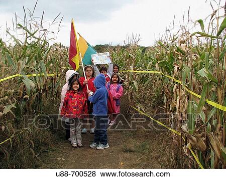 Stock Photo - Kids in a corn maze.. Fotosearch