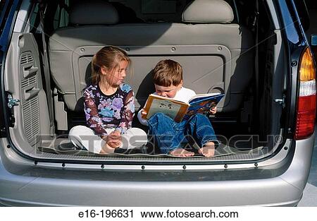 Kids in car reading View Large Photo Image Stock Image - Kids in car reading. Fotosearch
