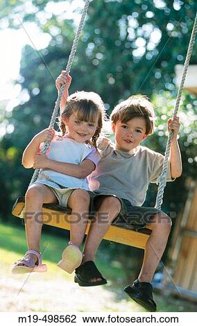 kids on a swing View Large Photo Image Stock Image - kids on a swing. Fotosearch