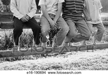 Kids on park fence View Large Photo Image Picture - Kids on park fence. Fotosearch