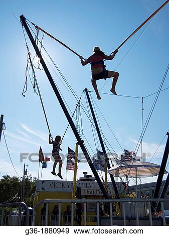 Kids on rope ride at the Maine Lobster Festival in Rockland, Maine, United States. View Large Photo Image Stock Photo - Kids on rope ride at the Maine Lobster Festival in Rockland, Maine, United States.. Fotosearch