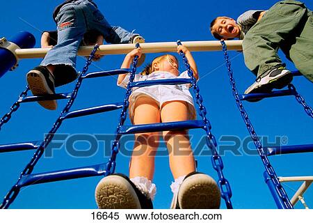 Kids playing at the playground View Large Photo Image Stock Photography - Kids playing at the playground. Fotosearch