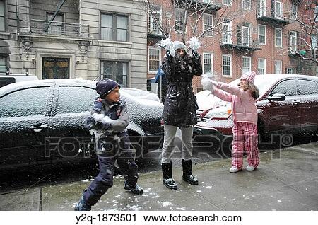 Kids playing with snowballs View Large Photo Image Stock Image - Kids playing with snowballs. Fotosearch