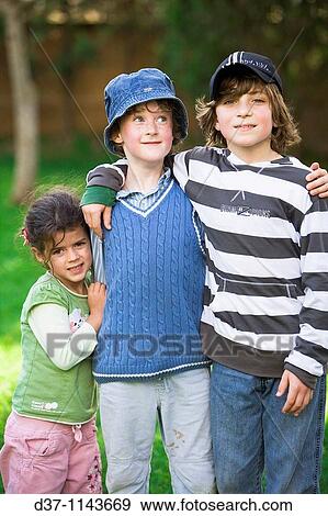 Kids posing in the garden View Large Photo Image Stock Photo - Kids posing in the garden. Fotosearch