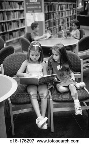 Kids reading in the library View Large Photo Image Stock Photo - Kids reading in the library. Fotosearch