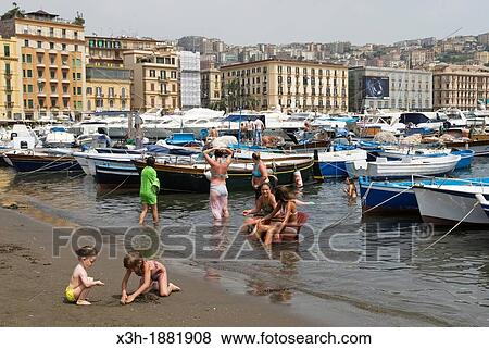 kids swimming at the harbour of Mergellina, Chiaia district, Naples, Campania region, southern Italy, Europe View Large Photo Image Stock Photo - kids swimming at the harbour of Mergellina, Chiaia district, Naples, Campania region, southern Italy, Europe. Fotosearch