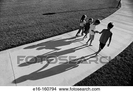 Kids walking down path together View Large Photo Image Picture - Kids walking down path together. Fotosearch