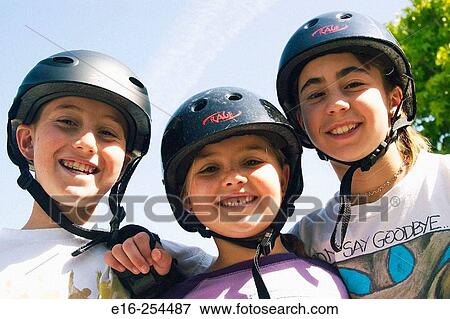 Kids wearing bike helmets View Large Photo Image Stock Photo - Kids wearing bike helmets. Fotosearch