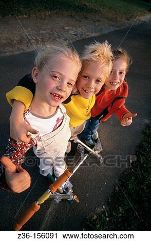 Kids with scooters View Large Photo Image Stock Image - Kids with scooters. Fotosearch