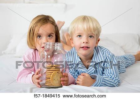 Kids with their hand in the cookie jar View Large Photo Image Stock Photography - Kids with their hand in the cookie jar. Fotosearch