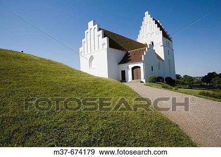 Kirkegardsudvalged church with burial mound. Hijertebjerg. Denmark View Large Photo Image Stock Photo - Kirkegardsudvalged church with burial mound. Hijertebjerg. Denmark. Fotosearch