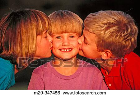 Stock Photograph - Kiss on cheek. Fotosearch