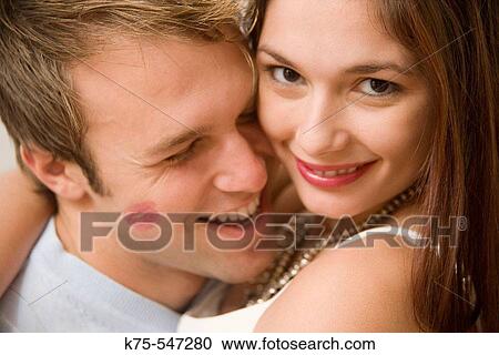 Stock Image - kissing and hugging. Fotosearch