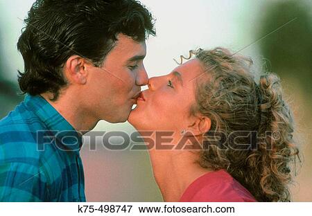 Kissing couple View Large Photo Image Stock Photo - Kissing couple. Fotosearch