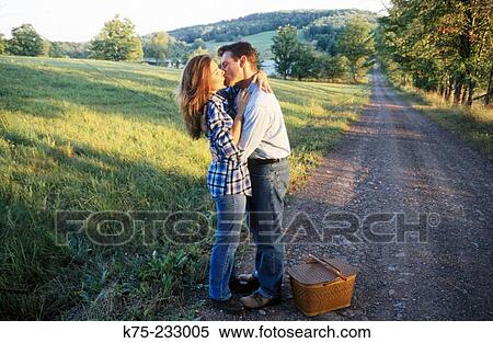 Kissing on a country road View Large Photo Image Stock Photography - Kissing on a country road. Fotosearch