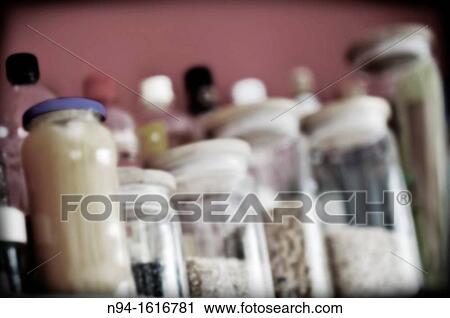 Kitchen shelf with glass jars with ingredients for cooking. View Large Photo Image Stock Image - Kitchen shelf with glass jars with ingredients for cooking.. Fotosearch