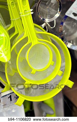 Stock Image - Kitchen sieves for sale in a supermarket, Barcelona, Catalonia, Spain. Fotosearch