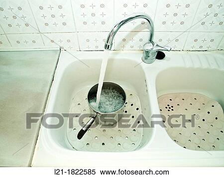 Kitchen sink, water filling a pot. View Large Photo Image Stock Photography - Kitchen sink, water filling a pot.. Fotosearch