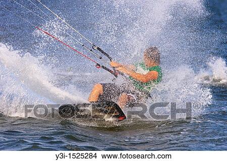 Picture - Kite boarder just off of Fort Desoto Park, a popular location for kite boarding in Tampa Bay, Florida, USA. Fotosearch