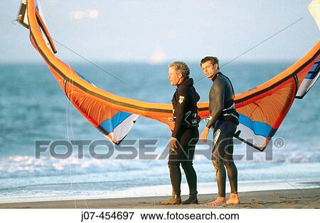 Stock Photo - Kite surfers or kite sailors.. Fotosearch