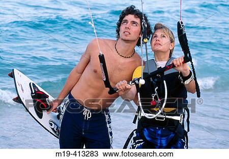kite surfing couple View Large Photo Image Stock Image - kite surfing couple. Fotosearch