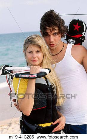 Stock Photograph - kite surfing couple. Fotosearch